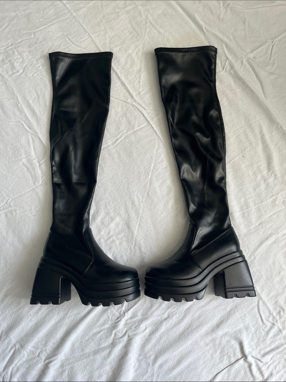 Black platform knee high boots